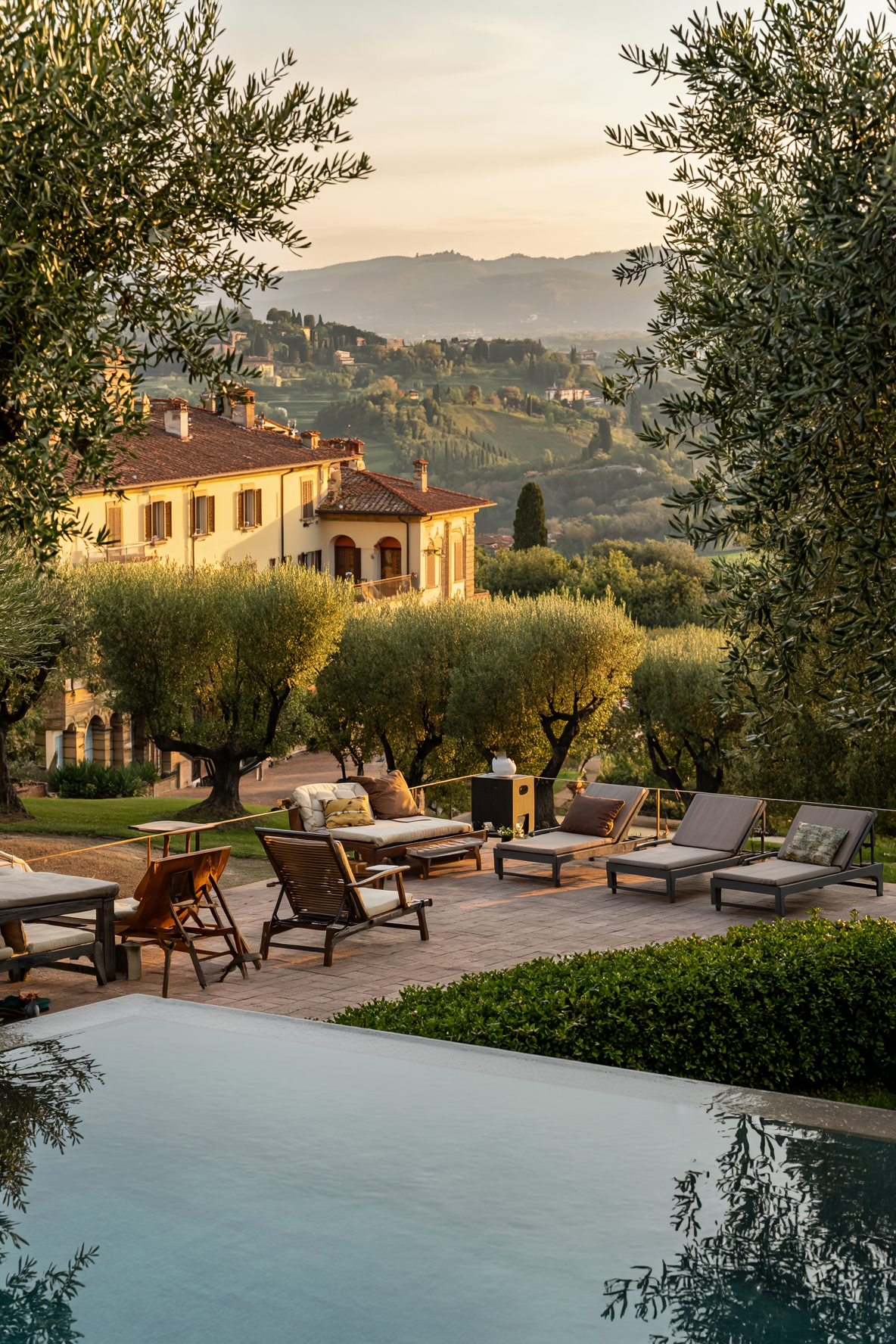 A hillside villa terrace overlooking Florence at golden hour